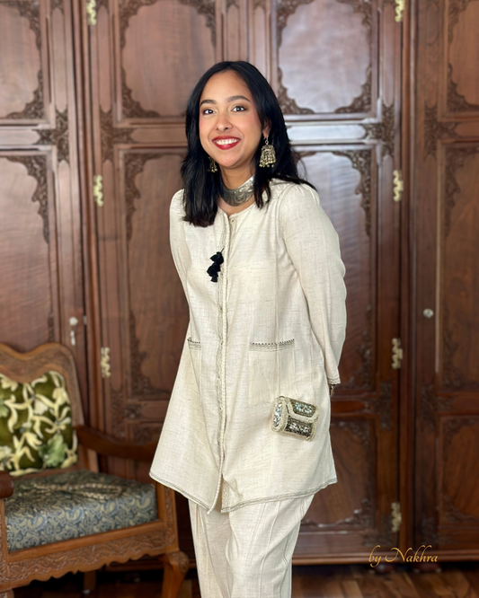 Side view of Morning Haze co-ord in ivory khadi cotton with contrast topstitching and handmade tassels